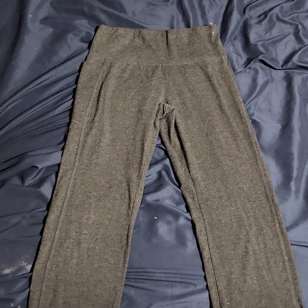 Yoga pants wider at the bottom their a small in women and they are dark Grey